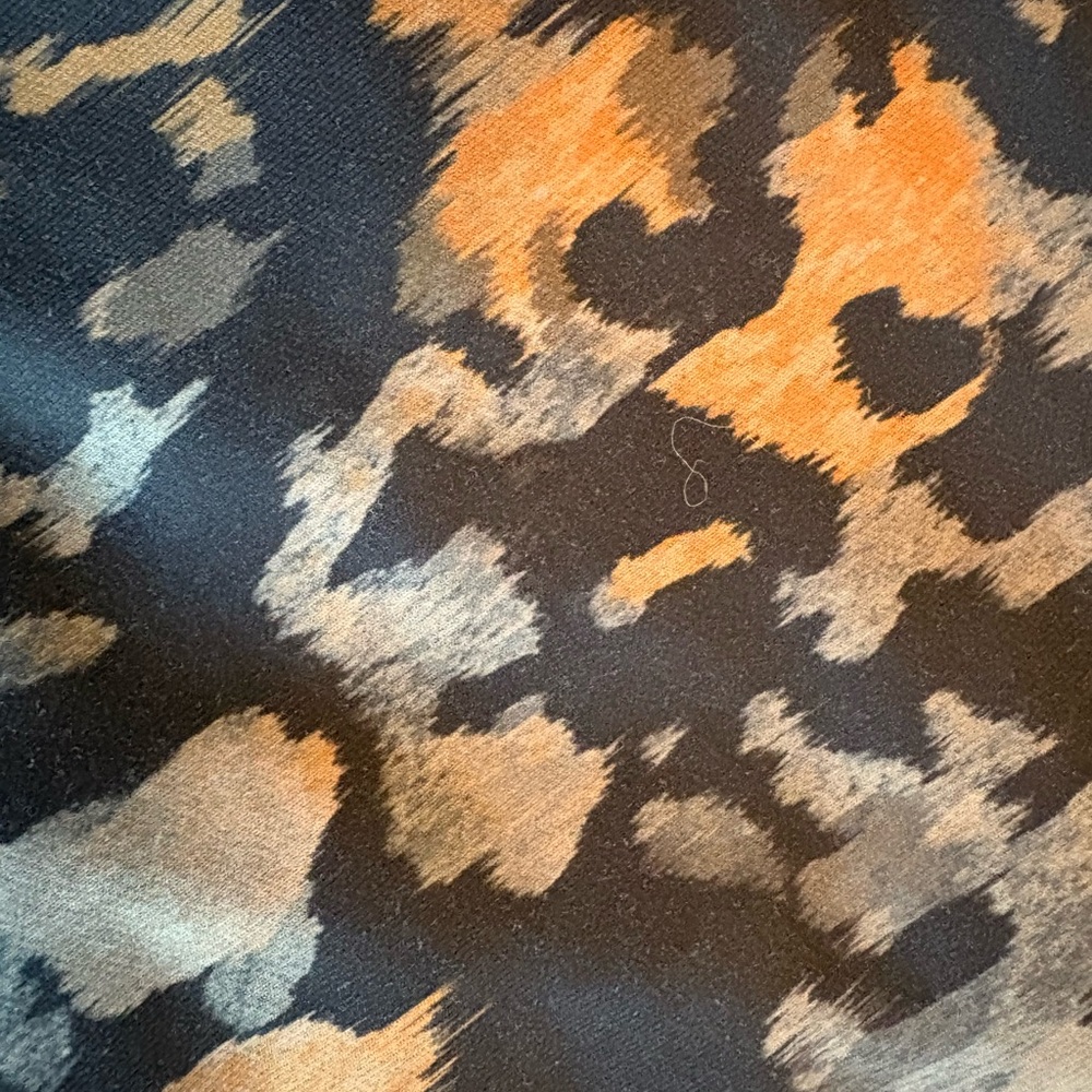Fabletics High-waist Black, Rust, and Brown Leopard Print Leggings.
